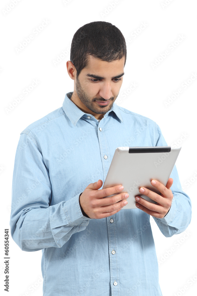 Arab saudi man reading a tablet reader isolated Arab saudi man reading a tablet reader isolated