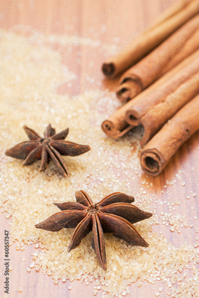 Star anise and cinnamon sticks on brown sugar Star anise and cinnamon sticks on brown sugar