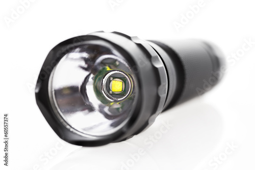 Professional LED flashlight isolated on white background