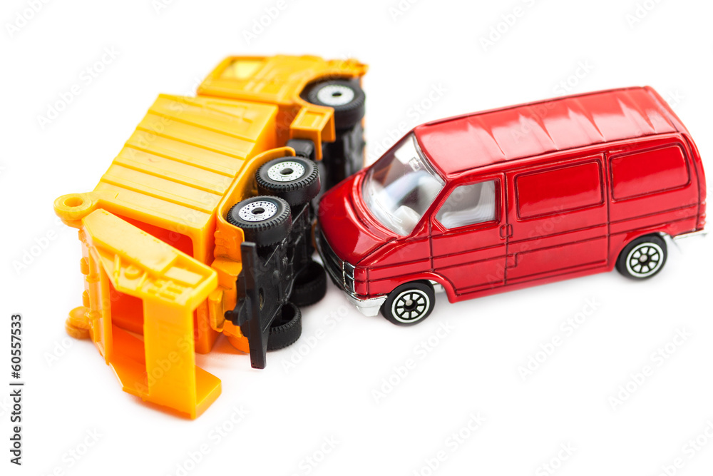 Toy cars in accident on a white background.