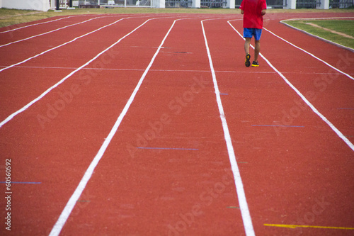 man ready to start running on running track