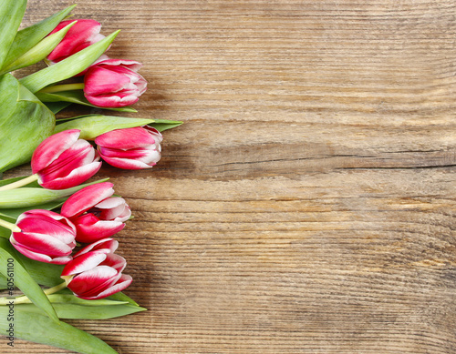 Fototapeta Naklejka Na Ścianę i Meble -  Bouquet of pink tulips on wooden background. Copy space