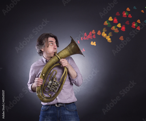 Adult man is playing on a big tube