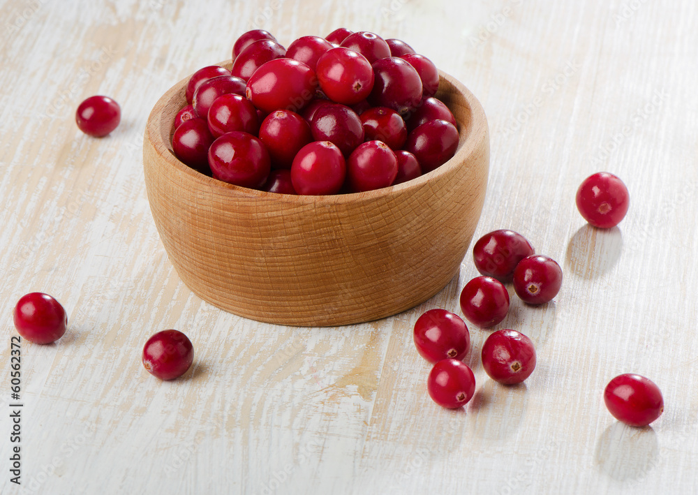Cranberries on wooden table Cranberries on wooden table