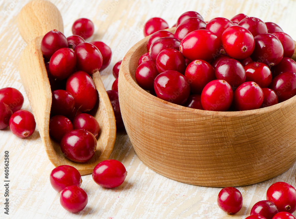 Cranberries on wooden table Cranberries on wooden table