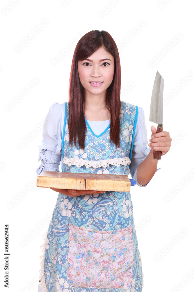 female chef holding the chopping block and knife female chef holding the chopping block and knife