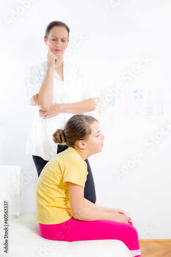Chiropractor doing adjustment on female patient