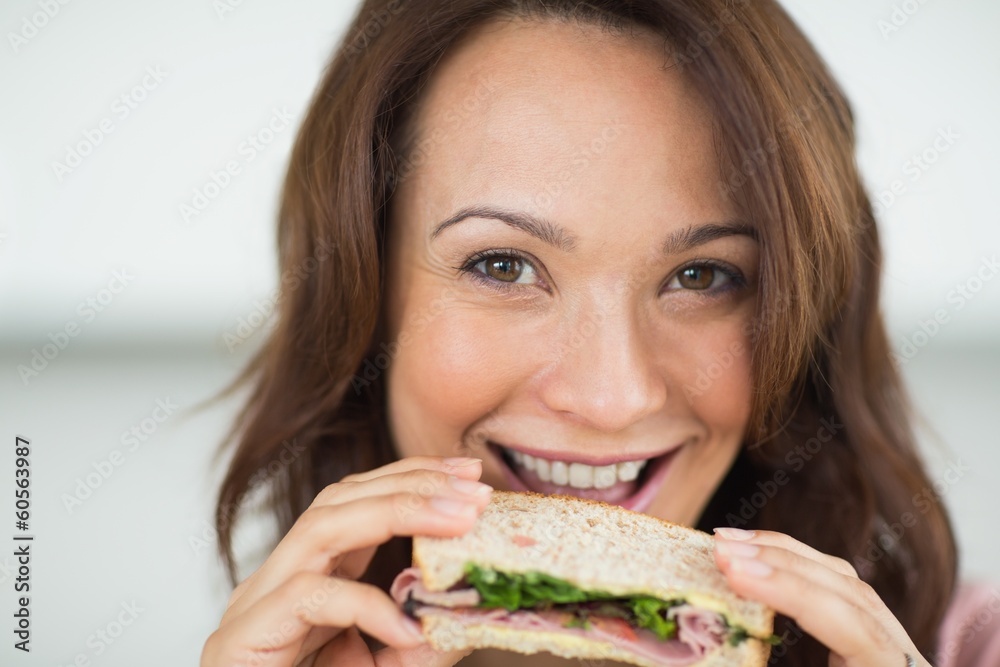 Closeup of a woman eating sandwich Closeup of a woman eating sandwich