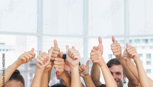 Closeup of cropped people gesturing thumbs up