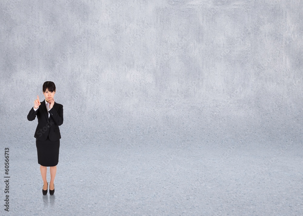 Composite image of thoughtful businesswoman pointing Composite image of thoughtful businesswoman pointing