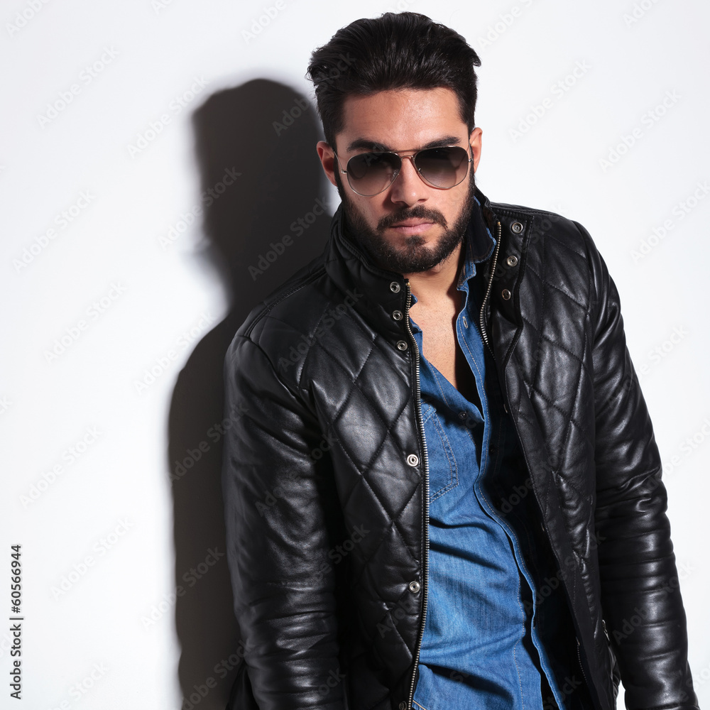 dramatic man in leather jacket and sunglasses posing dramatic man in leather jacket and sunglasses posing