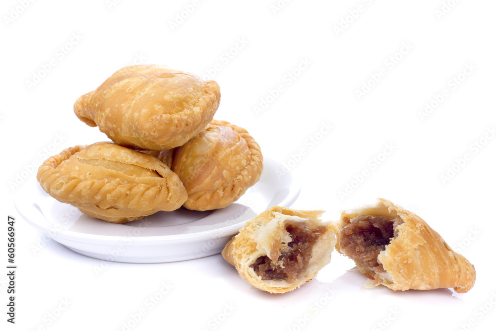  curry puffs isolated on a white background.