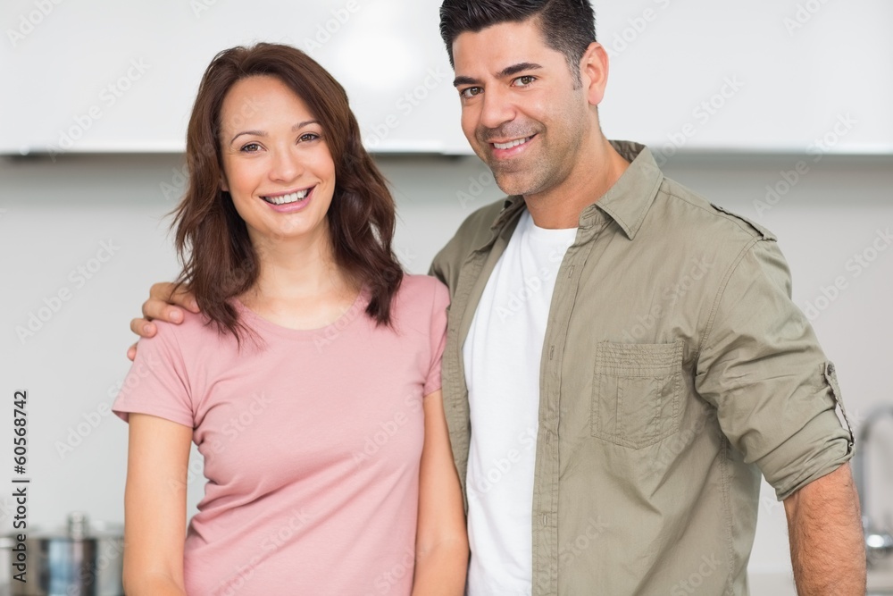 Portrait of a smiling couple in the kitchen Portrait of a smiling couple in the kitchen