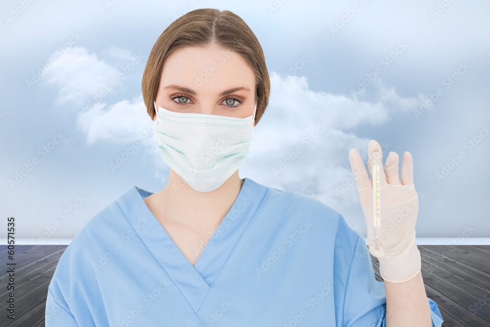 Composite image of young female doctor holding a thermometer Composite image of young female doctor holding a thermometer