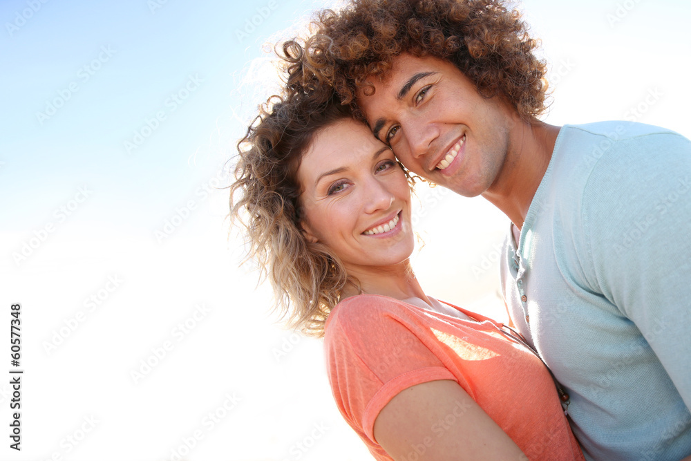 In love couple embracing each other at the beach