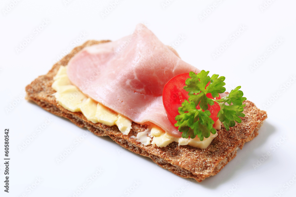 Brown crisp bread with ham