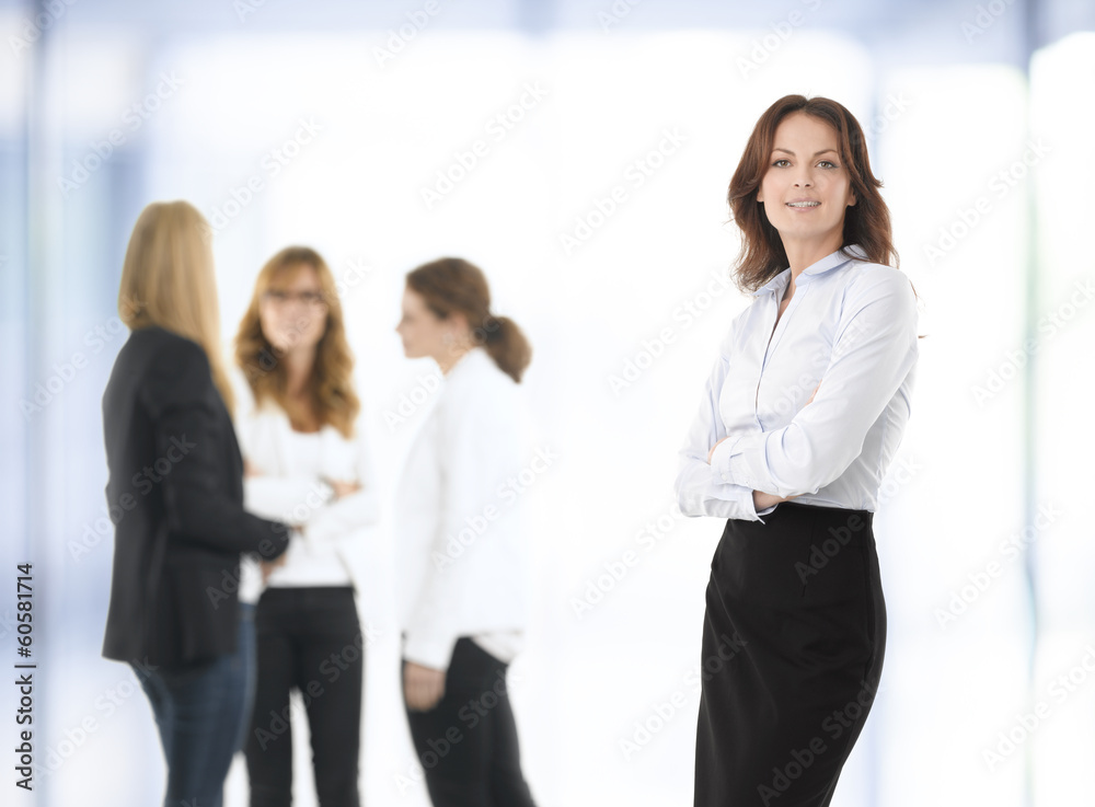 Beautiful businesswoman standing in office Beautiful businesswoman standing in office