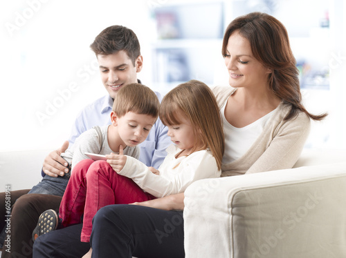 Happy family sitting in living room