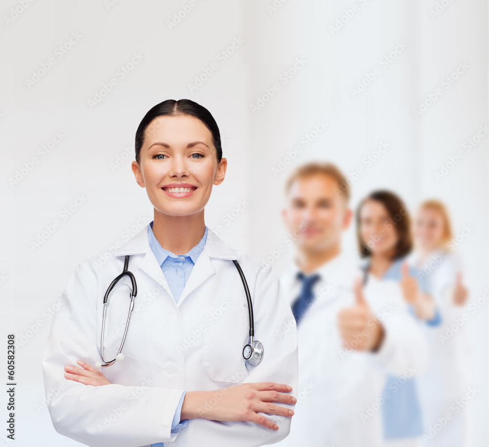 smiling female doctor with stethoscope smiling female doctor with stethoscope