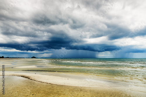 Stormy sky and beach at low tide