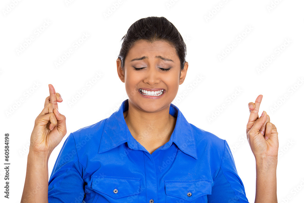 Woman crossing fingers wishing, praying for miracle Woman crossing fingers wishing, praying for miracle