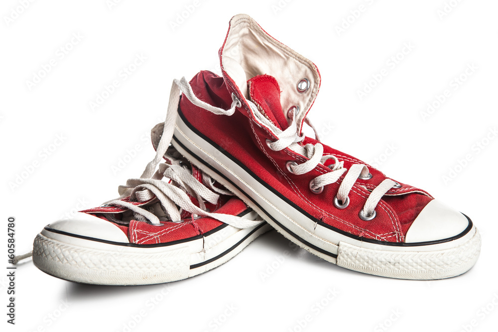 Dirty old sneakers isolated on white - obrazy, fototapety, plakaty 