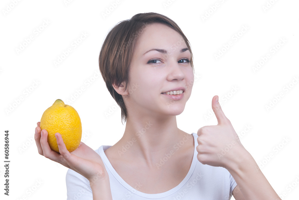 Pretty young girl with yellow lemon showing ok Pretty young girl with yellow lemon showing ok