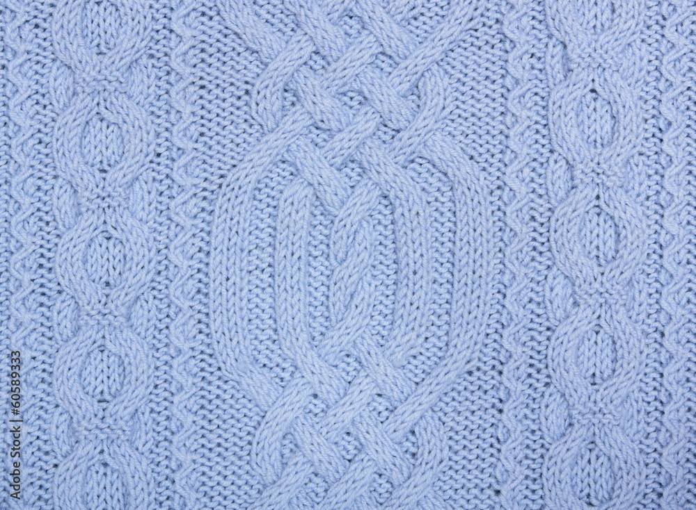 Knit woolen texture. Blue fabric