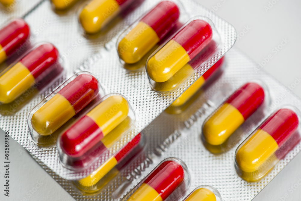Macro of red - yellow pills Macro of red - yellow pills