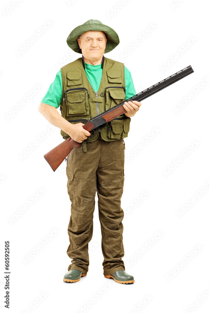 Full length portrait of male hunter holding a rifle Full length portrait of male hunter holding a rifle