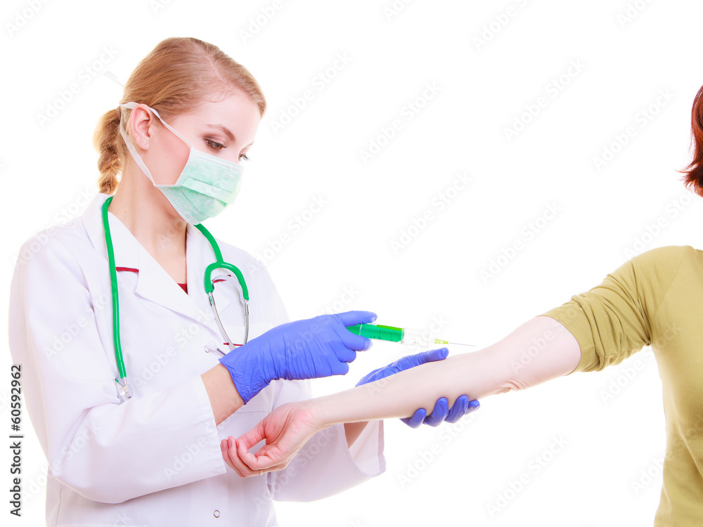 Hands of doctor nurse with syringe giving injection to patient Hands of doctor nurse with syringe giving injection to patient
