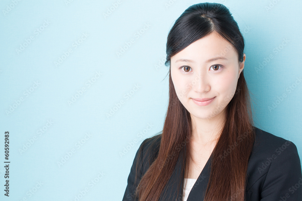 young asian businesswoman on blue background young asian businesswoman on blue background