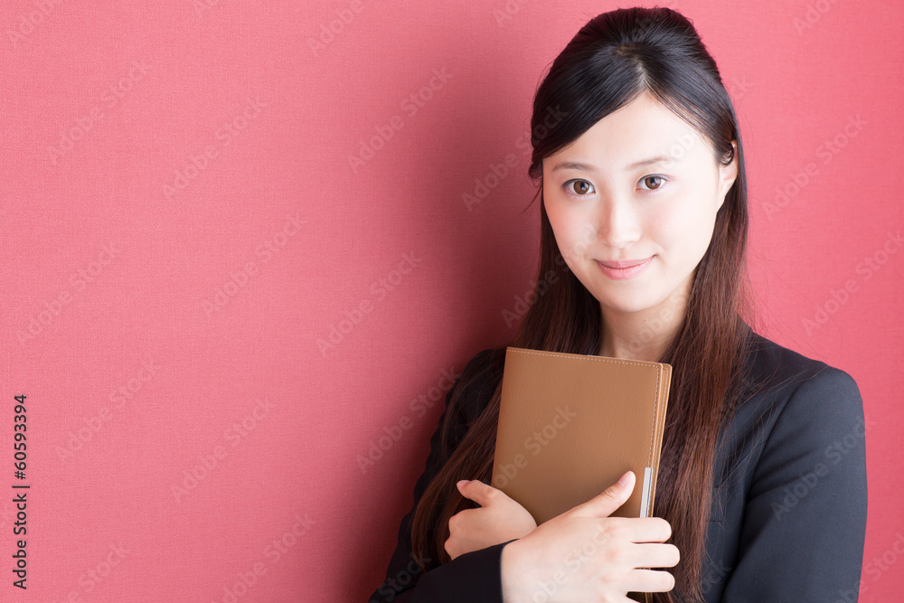 young asian businesswoman on red background
