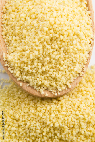 couscous in wooden spoon photo