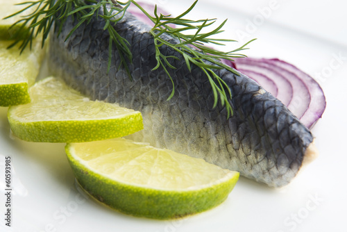 Fillet herring with onion and lemon photo