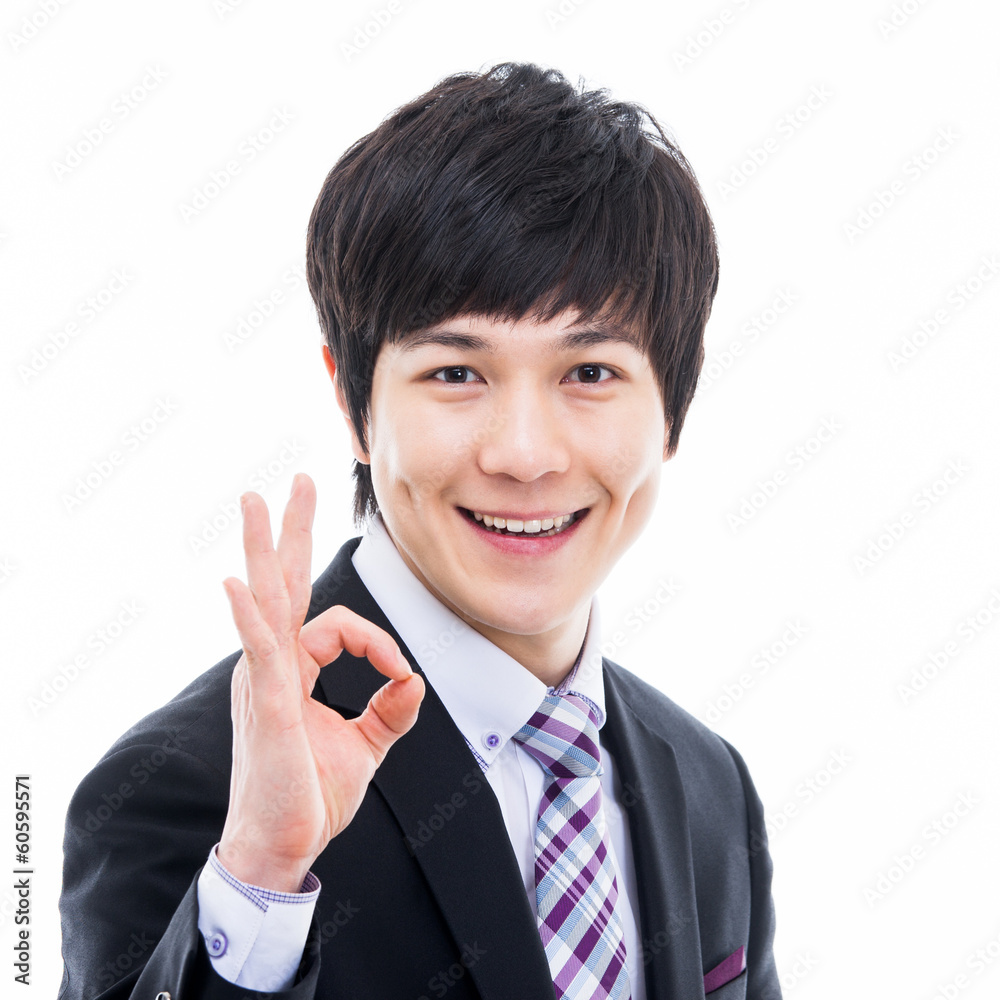 Showing thumb Asian young business man close up shot Showing thumb Asian young business man close up shot