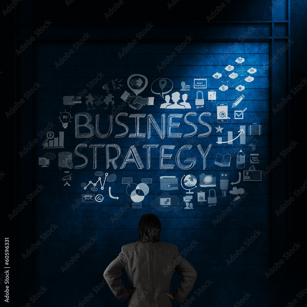 businessman looking at business strategy hand drawn chart as con businessman looking at business strategy hand drawn chart as con