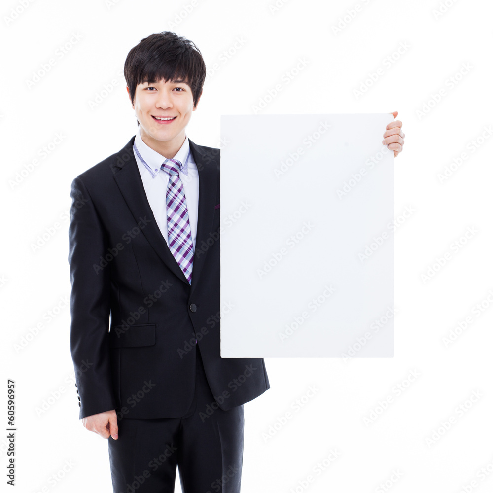 Young Asian business man holding a blank banner Young Asian business man holding a blank banner