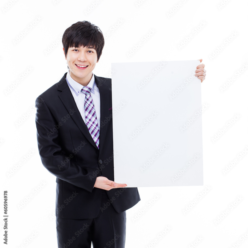 Young Asian business man holding a blank banner Young Asian business man holding a blank banner
