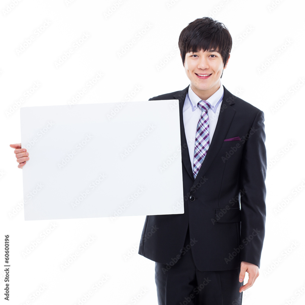 Young Asian business man holding a blank banner Young Asian business man holding a blank banner