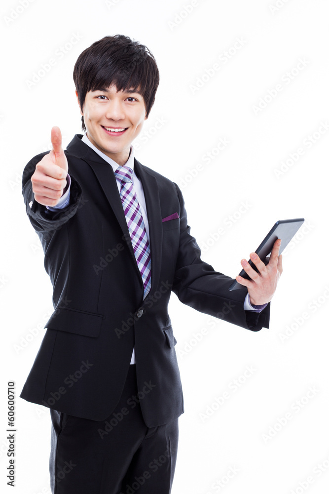 Young Asian business man using a pad PC Young Asian business man using a pad PC