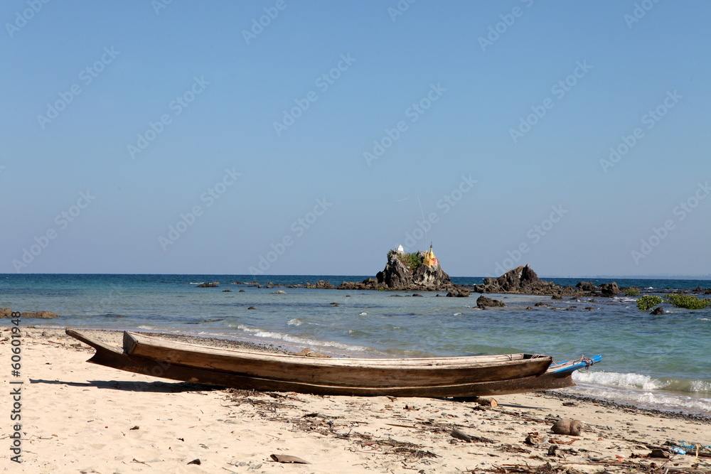 Buddhist pagodas on top of rocks found on the beach of Ngwe Saung, west coast of Myanmar
