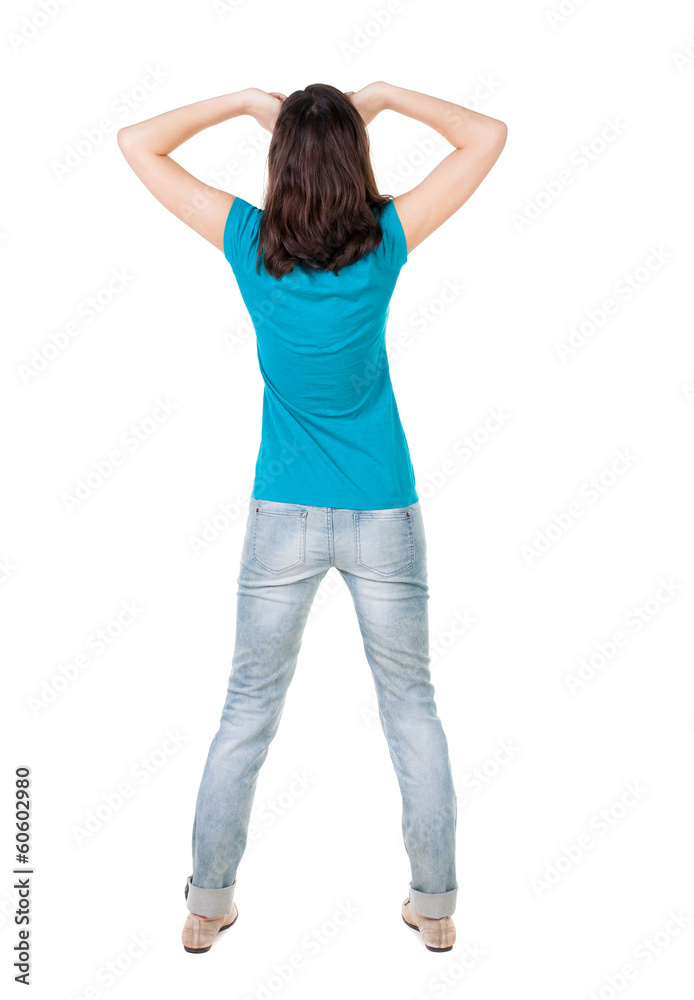 Back view of shocked woman in blue jeans Back view of shocked woman in blue jeans