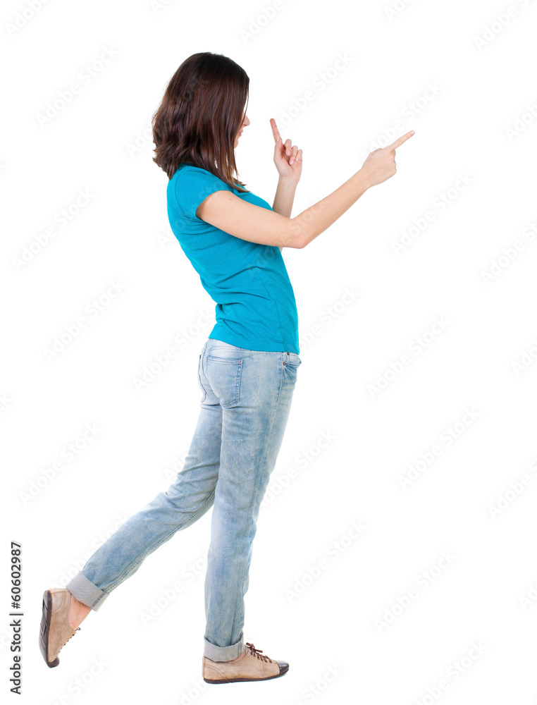 Back view of pointing woman. Back view of pointing woman.