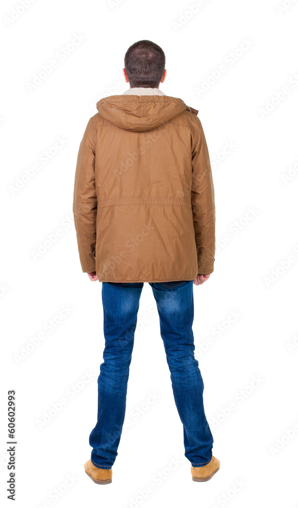 Back view of handsome man in winter parka looking Back view of handsome man in winter parka looking