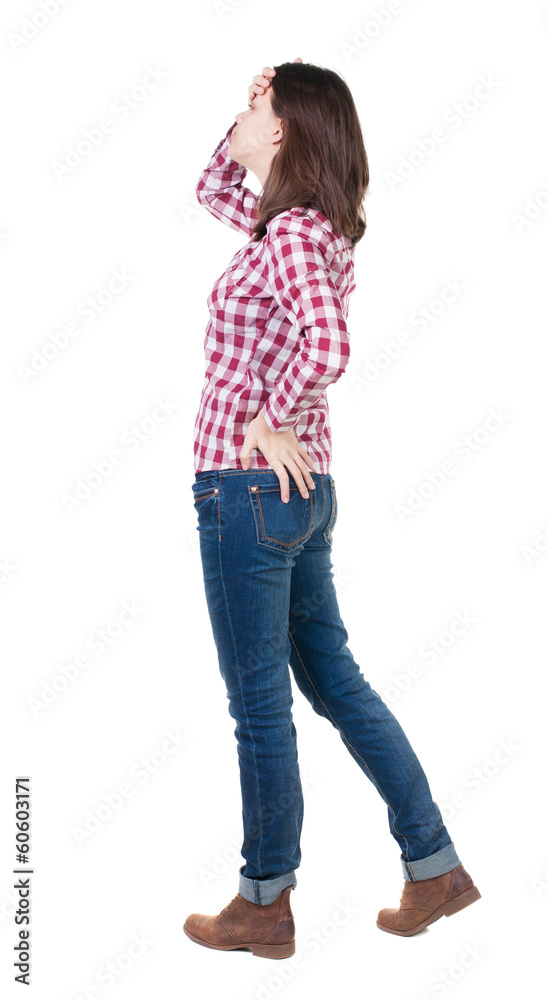 Back view of shocked woman in checkered shirt Back view of shocked woman in checkered shirt