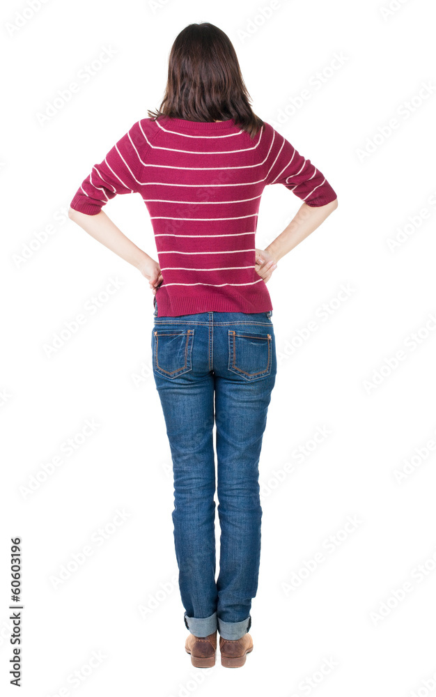 Obraz premium back view of standing young beautiful brunette woman in red pul
