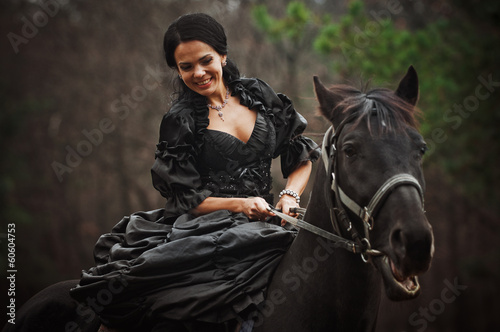 girl in costume on horseback