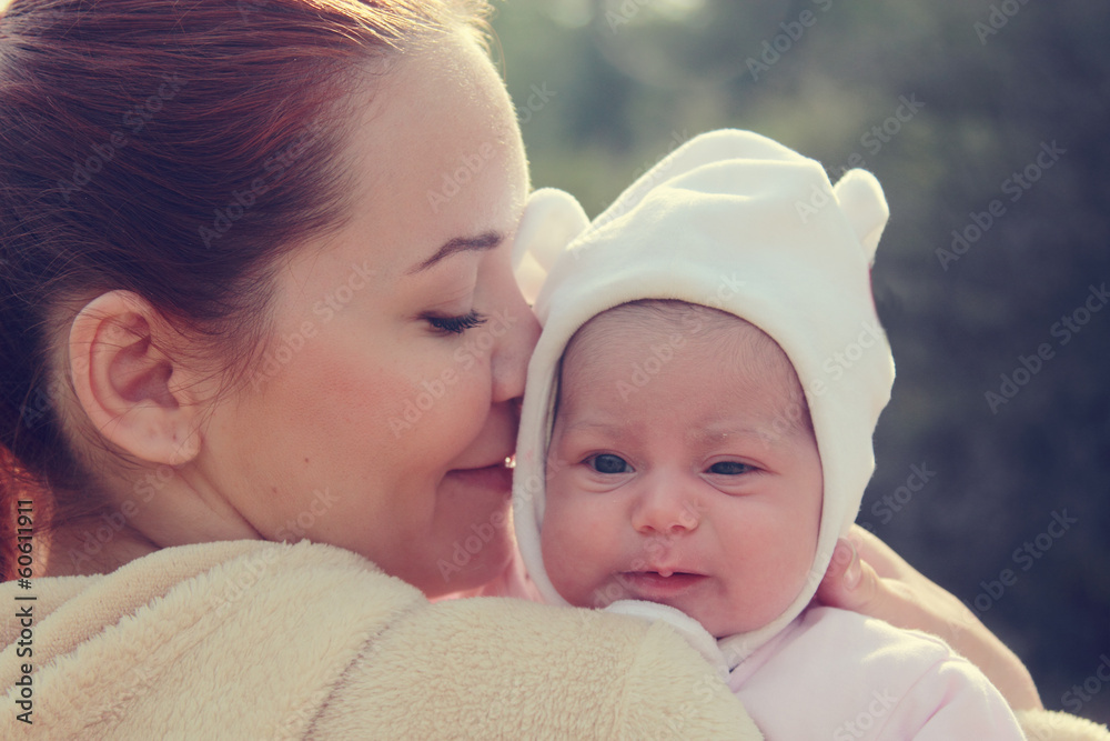 young mother with her newborn baby outdoor young mother with her newborn baby outdoor