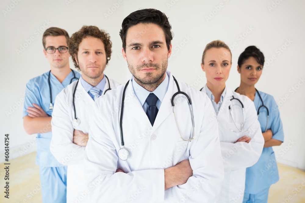 Medical team standing arms crossed Medical team standing arms crossed